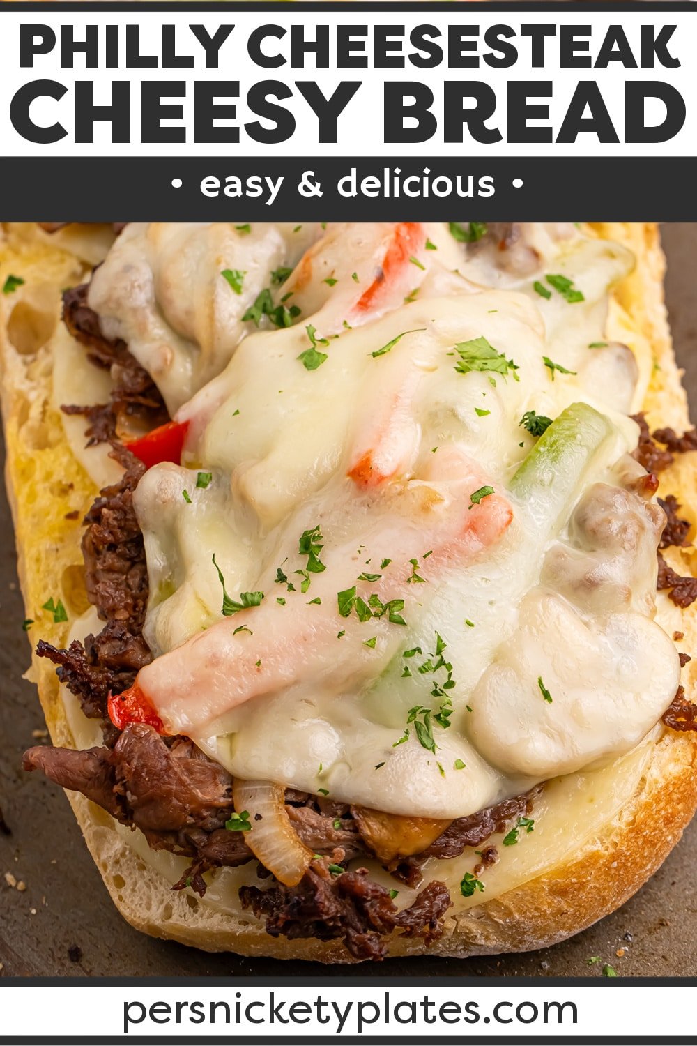 Everything you love about a Philly cheesesteak sandwich in crunchy, cheesy bread form! Steak, peppers, onions, and mushrooms are piled onto this comforting Philly Cheesesteak Bread. | www.persnicketyplates.com