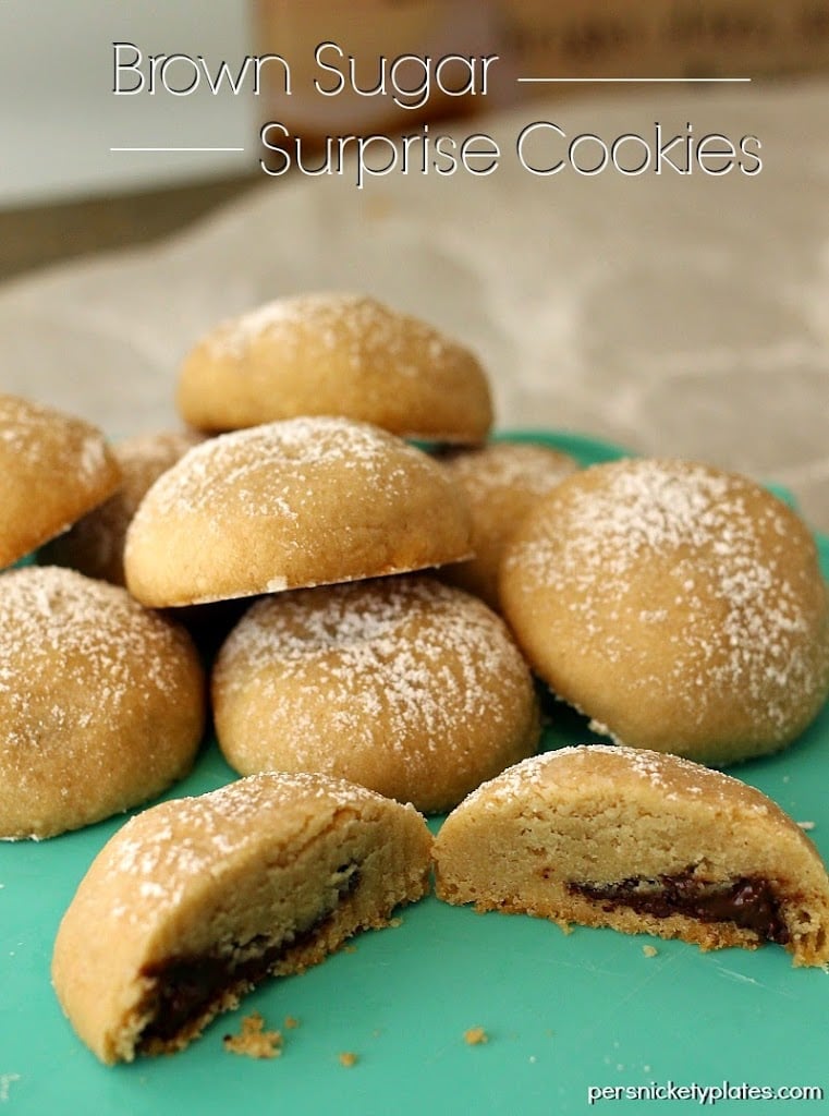 Brown Sugar Surprise Cookies - a simple, buttery, brown sugar cookie filled with a chocolate surprise! | www.persnicketyplates.com