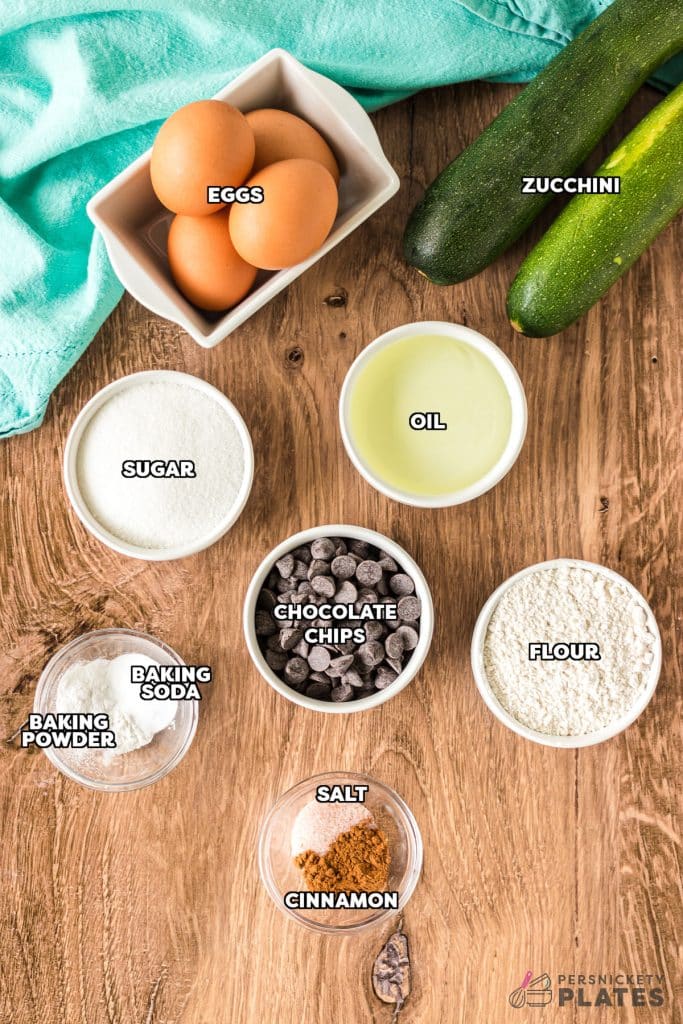 overhead shot of labeled ingredients laid out to make zucchini muffins.
