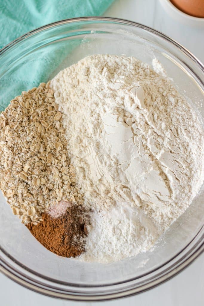 flour, oats, and other dry ingredients in a mixing bowl.