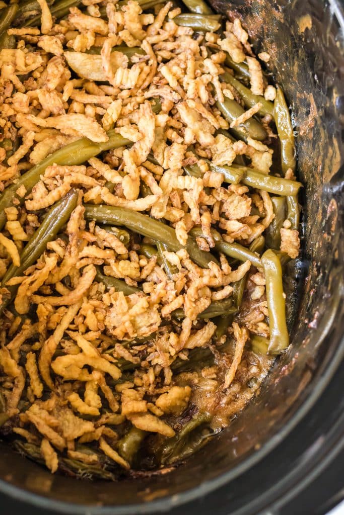 overhead shot of green bean casserole topped with fried onions.