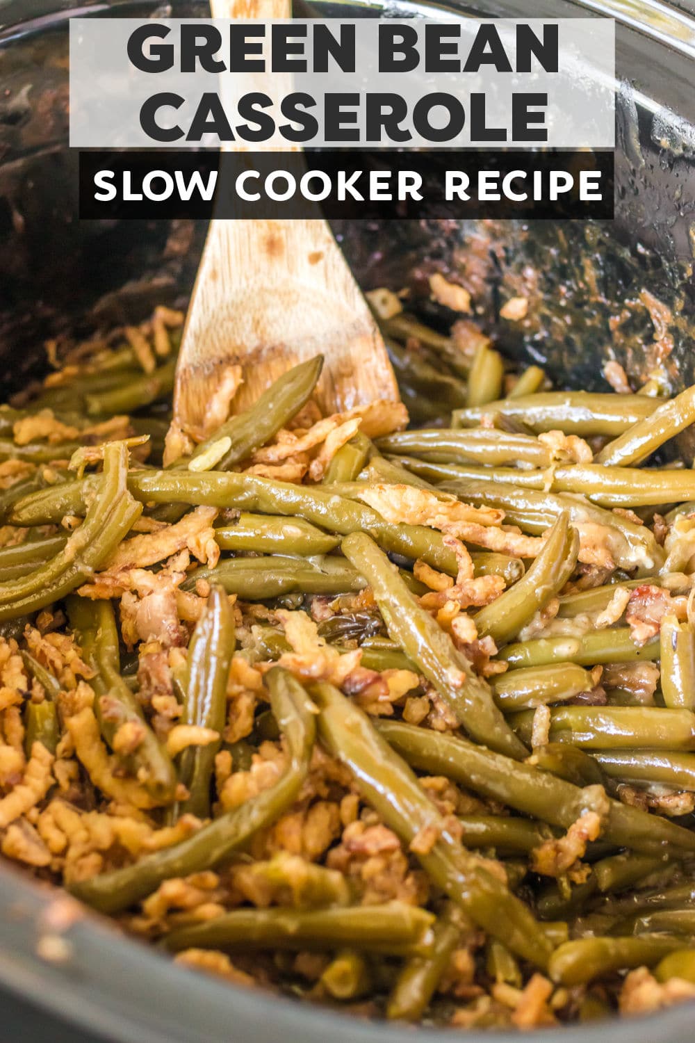 Slow cooker green bean casserole is so easy to make from scratch – without any canned soup! This comfort food classic recipe uses fresh green beans, has a creamy, bacon-filled sauce, is topped with crispy fried onions and is made right in the crockpot. This dish serves a crowd and comes out perfect every time. | www.persnicketyplates.com