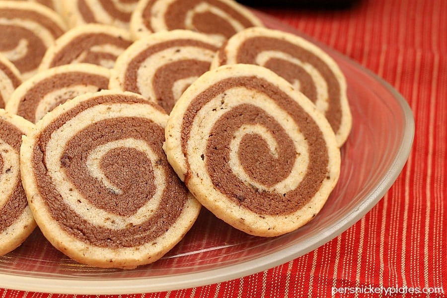 plate full of chocolate mocha swirl cookies on a red tablecloth