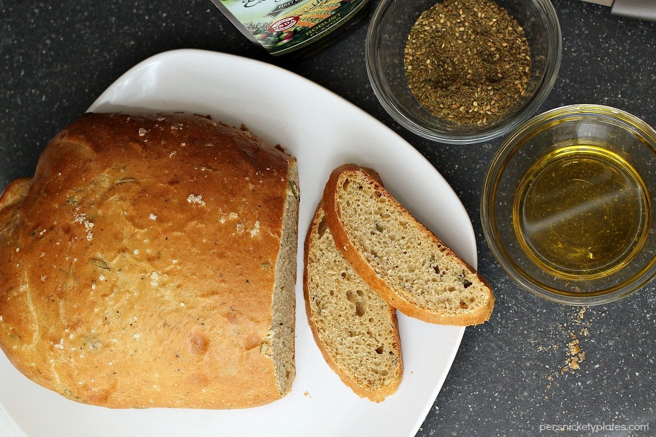 Rosemary Olive Oil Bread is light and flavorful and easy to make. This homemade bread is perfect served warm with a pat of creamy butter. Nothing much is better than fresh baked bread.