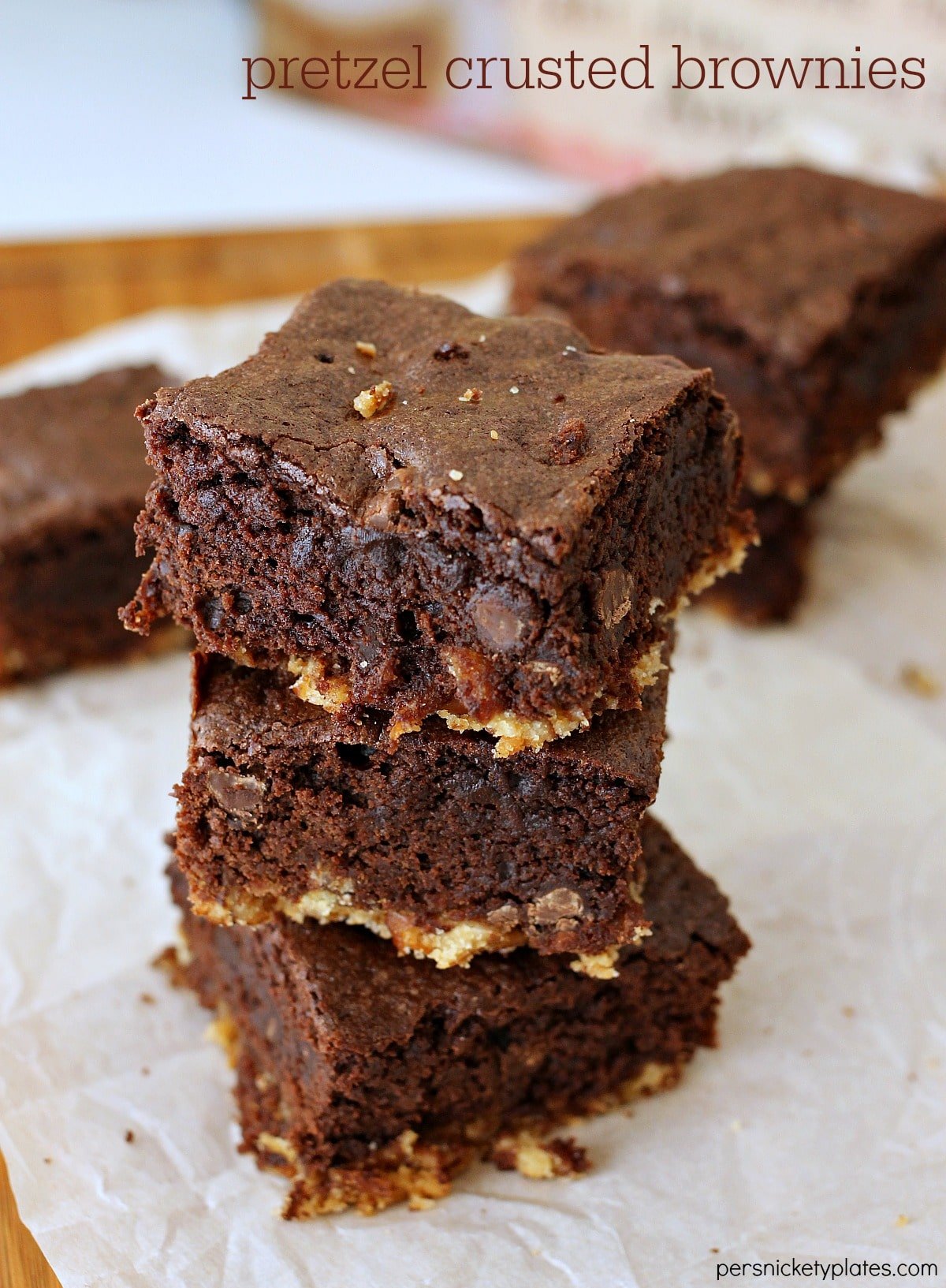 Pretzel Crusted Brownies have a layer of pretzel crust topped with a fudgy chocolate chip brownie. These sweet and salty brownies are a perfect sweet treat! | www.persnicketyplates.com