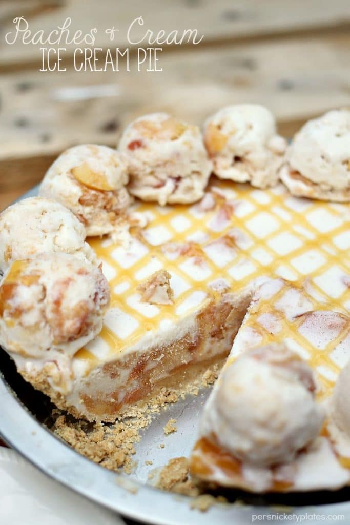 Peaches and Cream Ice Cream Pie is filled with broiled peaches, creamy vanilla bean ice cream, in a graham cracker crust and drizzled with butterscotch sauce. The perfect dessert for a hot summer day! | Persnickety Plates #SunsOutSpoonsOut #ad