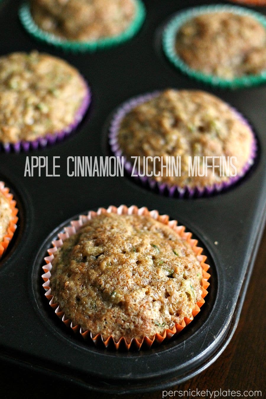 pan of muffins with text overlay reading "apple cinnamon zucchini muffins".