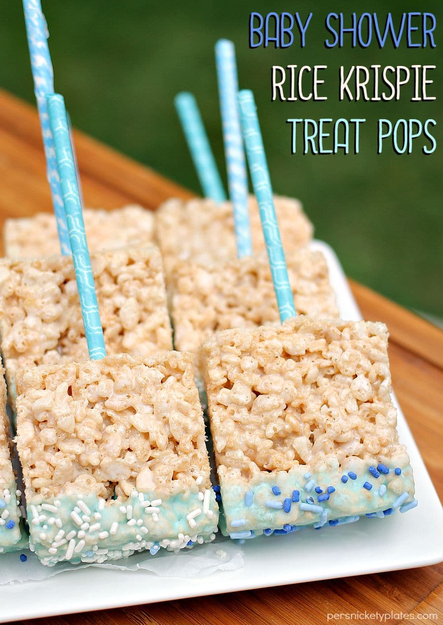 Rice Krispie Treat Pops dipped in baby blue glaze and sprinkles make such a fun baby shower treat! | www.persnicketyplates.com