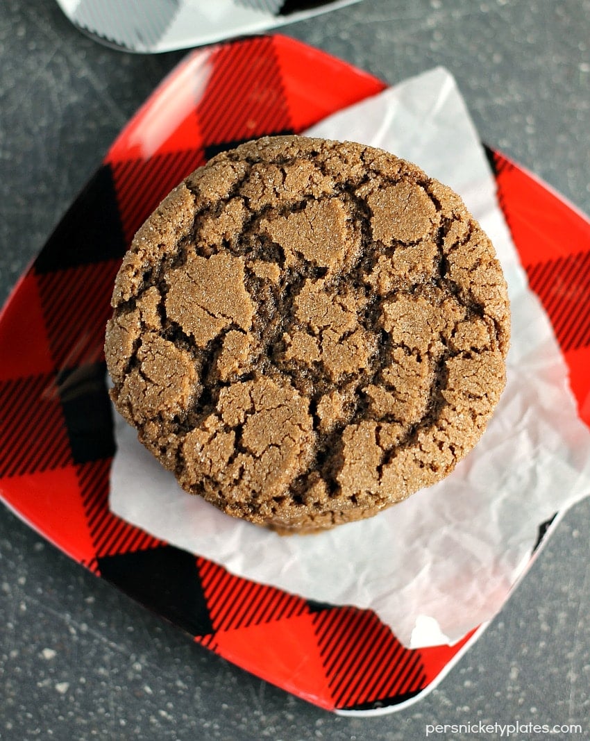 overhead shot of chocolate cookie on buffalo plaid red plate