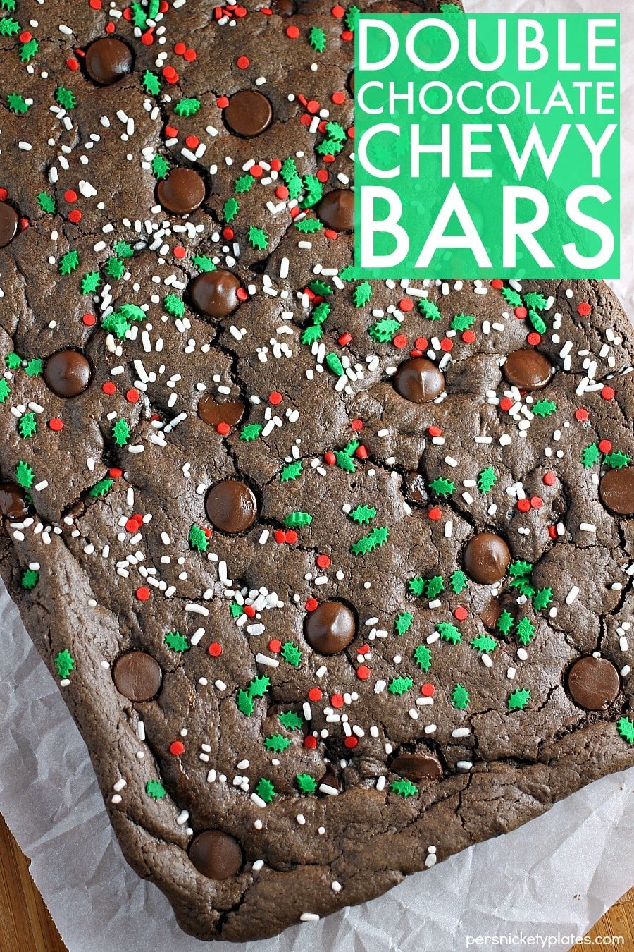 Double Chocolate Chewy Bars are semi-homemade and really simple - they start with a cake mix base and are dressed up with holiday sprinkles. Only five ingredients! | www.persnicketyplates.com
