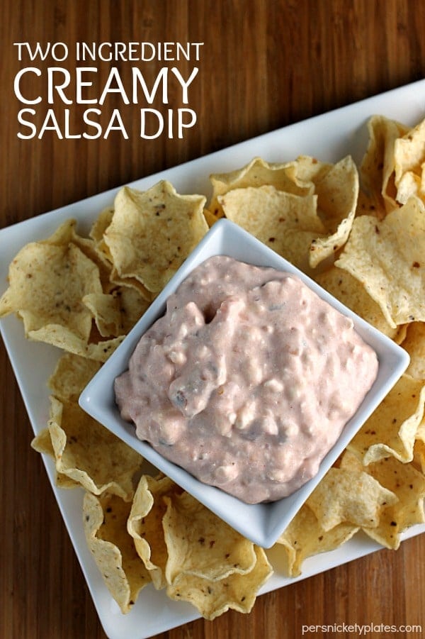 platter of tortilla chips dip in center with text reading "two ingredient creamy salsa dip"