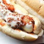 Easy Italian Chicken Meatball Subs smothered in a homemade marinara sauce and topped with provolone and mozzarella cheese! | Persnickety Plates