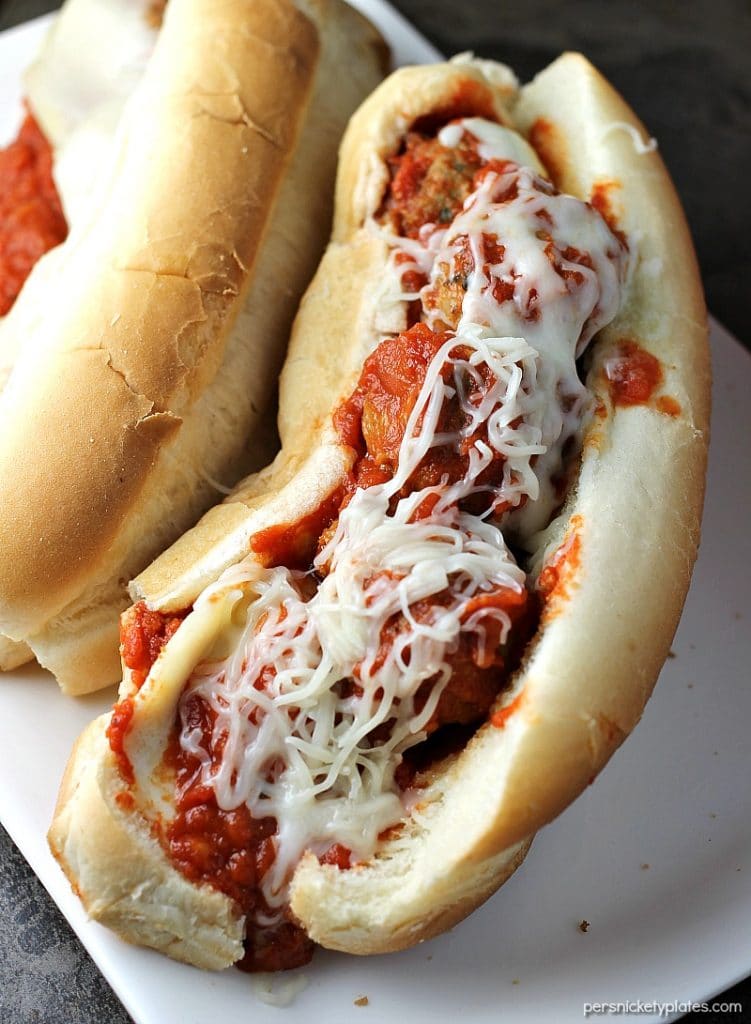 Easy Italian Chicken Meatball Subs smothered in a homemade marinara sauce and topped with provolone and mozzarella cheese! | Persnickety Plates