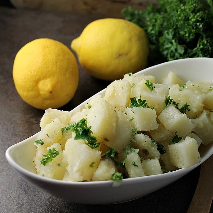 Super simple Arabic Potato Salad only has a few ingredients - potatoes, lemon, oil, garlic, and parsley – but is full of flavor and because there is no mayonnaise, it’s great for a picnic! | Persnickety Plates