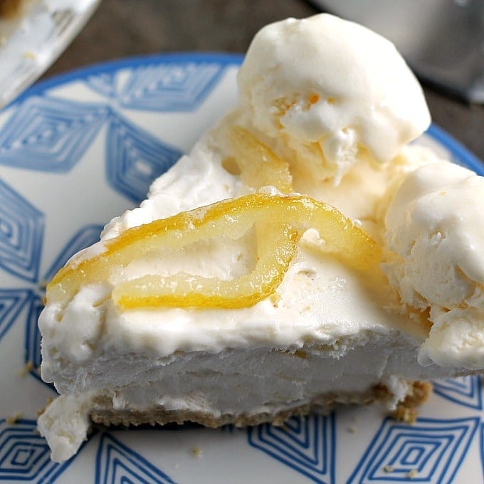 slice of lemonade ice cream pie topped with candied lemon strips.