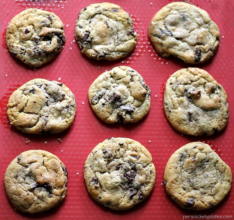 overhead shot of ny times chocolate chip cookies on a red silicone mat