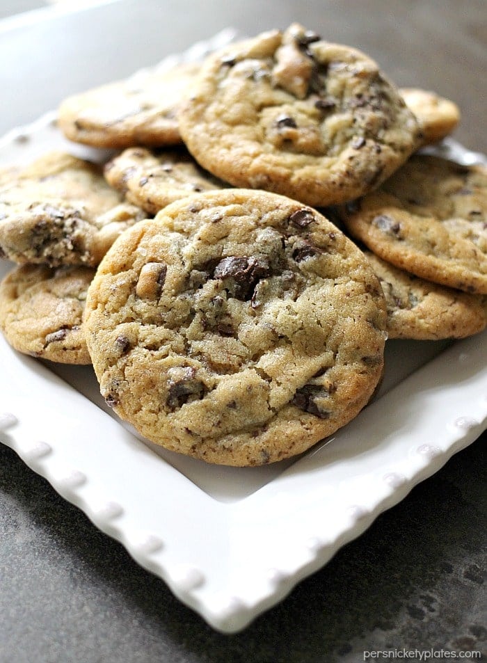 white plate full of chocolate chip cookies