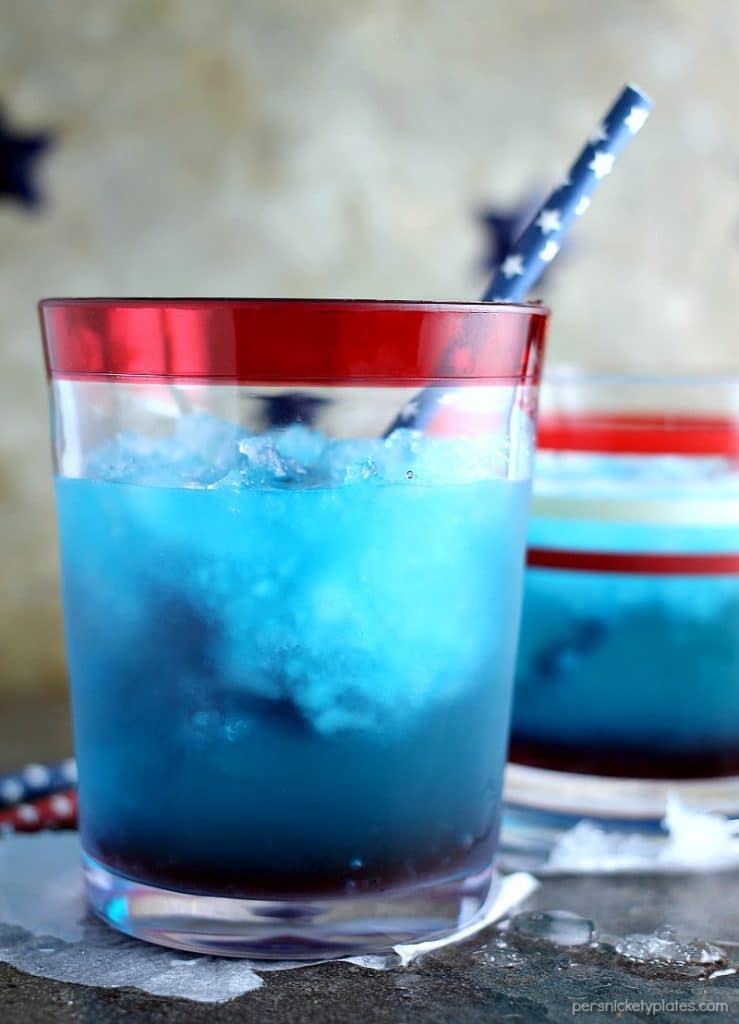 red white & blue vodka cocktail with a blue star straw.