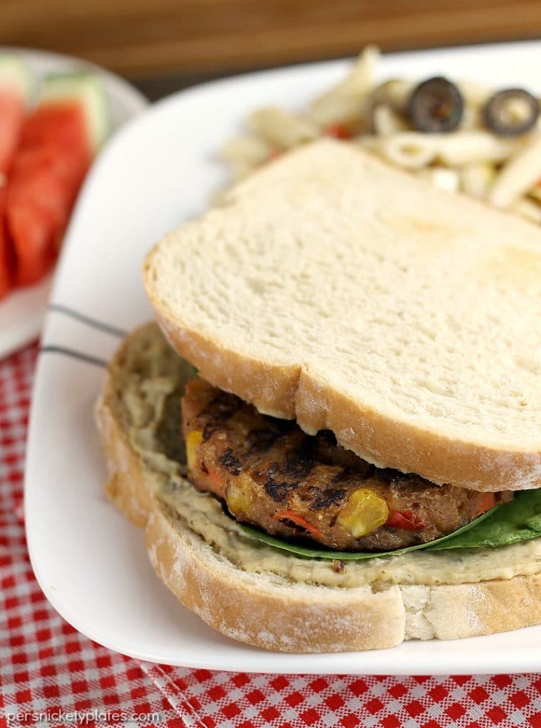 Vegetarians can enjoy barbecues, too! This Veggie Burger with Spinach and Hummus is the perfect alternative to traditional hamburgers for your next BBQ. | Persnickety Plates