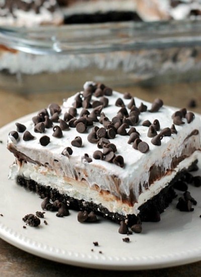 Chocolate lovers rejoice! This no-bake Chocolate Lasagna is filled with cream cheese, chocolate pudding, and chocolate chips on top of an Oreo cookie crust! | Persnickety Plates
