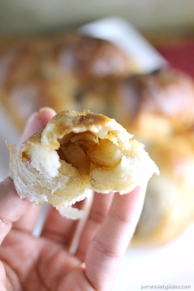 close up of apple filled pull apart bread in a hand