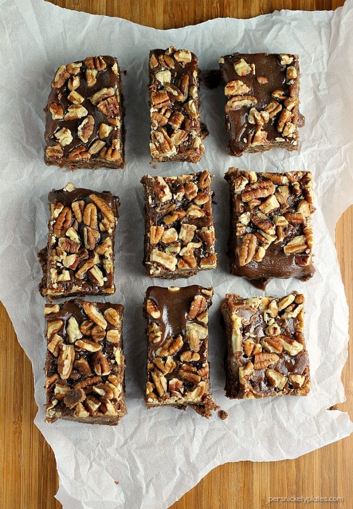 Salted Chocolate Caramel Bars start with a layer of chocolate shortbread, topped with a thick layer of homemade salted caramel, and finished off with toasted pecans. | Persnickety Plates