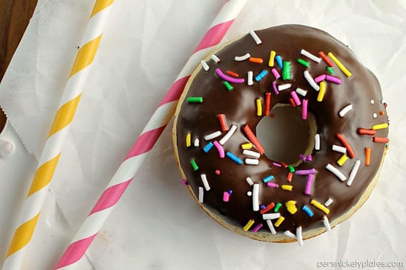 Chocolate Glazed Baked Cake Donuts covered in sprinkles. Homemade donuts are probably easier to make than you think and you can save a trip to the donut shop! | www.pChocolate Glazed Baked Cake Donuts covered in sprinkles. Homemade donuts are probably easier to make than you think and you can save a trip to the donut shop! | www.persnicketyplates.comersnicketyplates.com