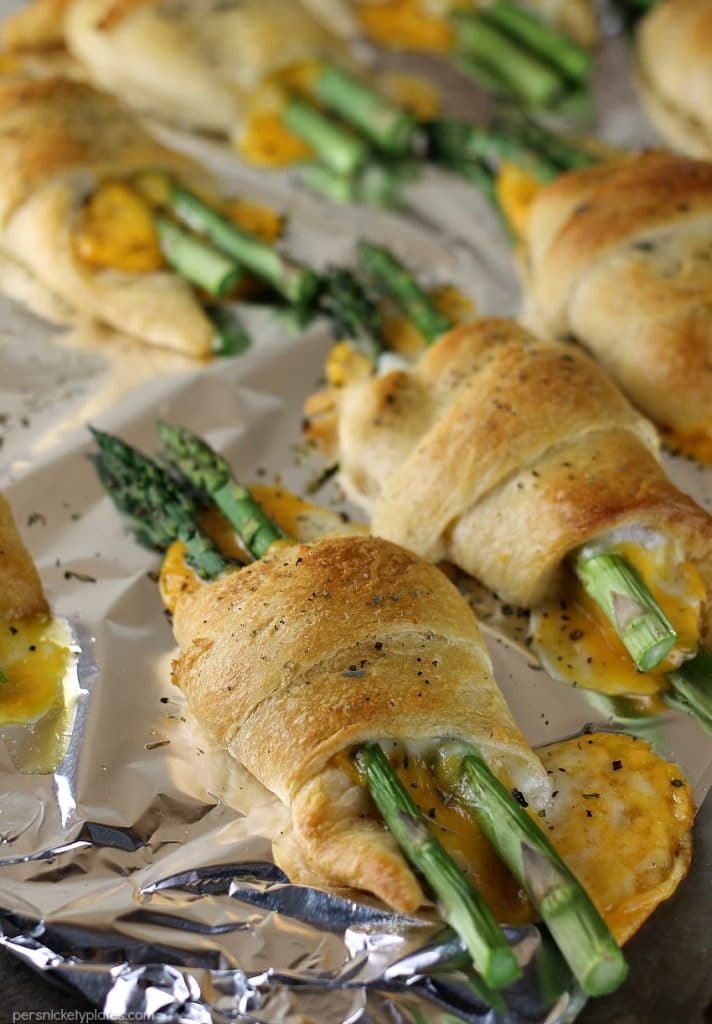 cheesy asparagus puffs on baking sheet straight from the oven