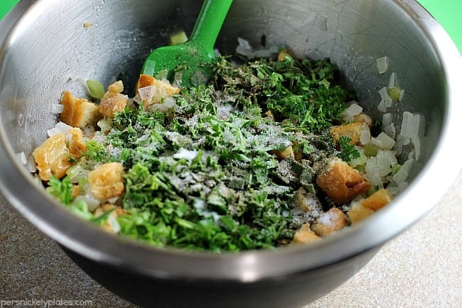 herbs and bread in mixing bowl