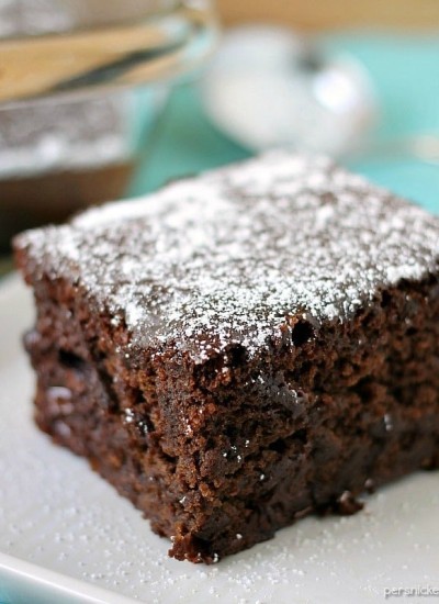 slice of chocolate cake topped with powdered sugar
