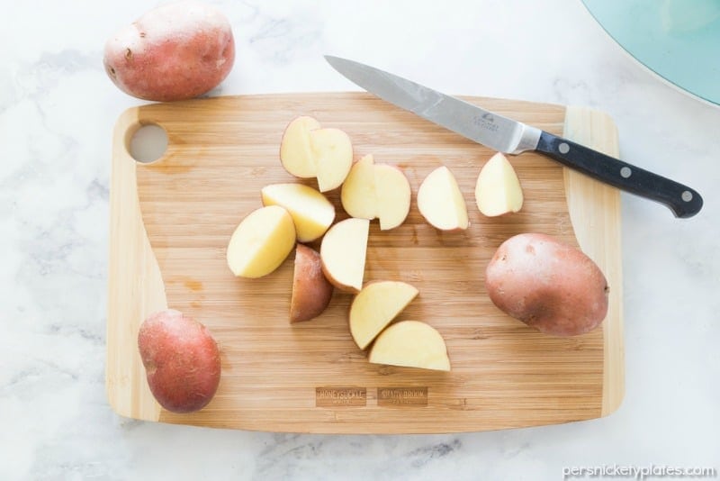 red skin potatoes on a cutting board