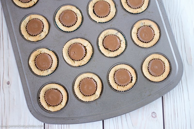 mini muffin pan filled with chocolate chip peanut butter cookie cups