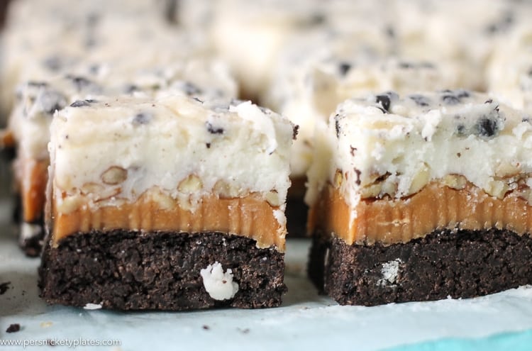 close up of cookies and cream caramel layer bars