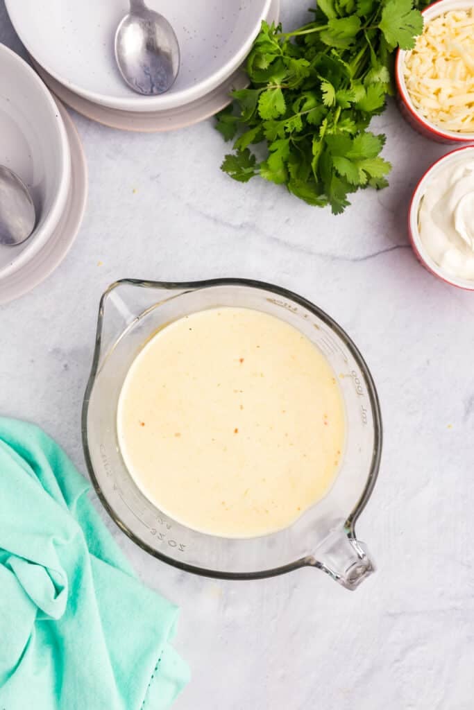 creamy sauce in a measuring cup.