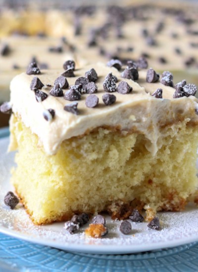close up of cannoli poke cake topped with mini chocolate chips