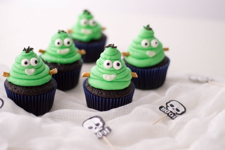 cupcakes topped with frankenstein poop emojis