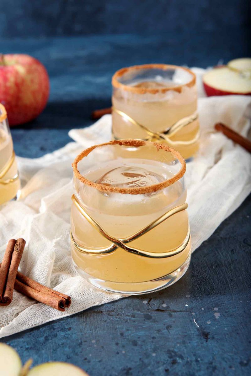 two gin apple pie cocktails with cinnamon sticks