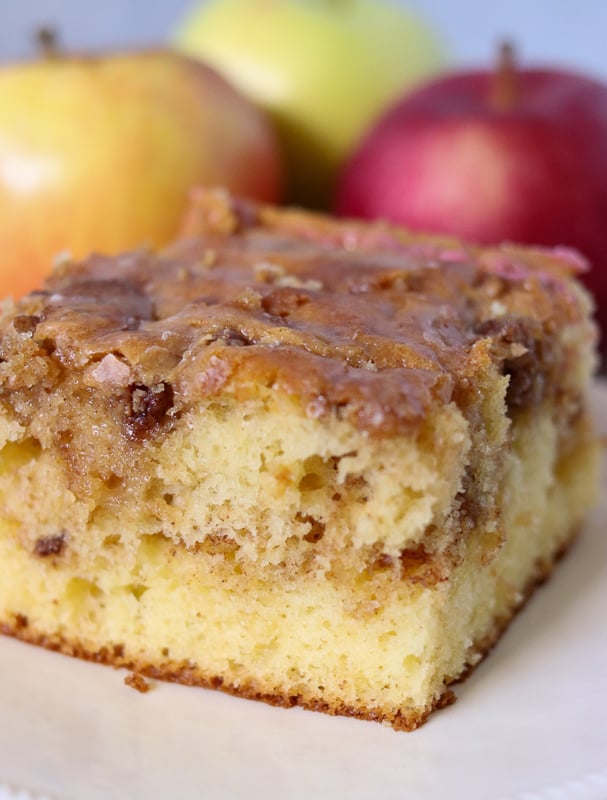 slice of honey bun cake surrounded by apples