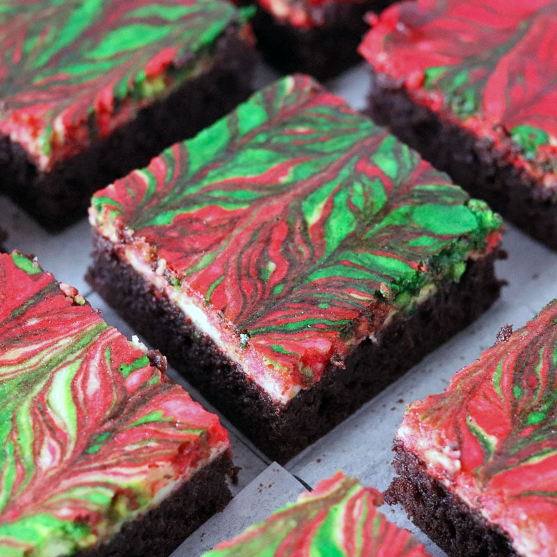 sliced red & green swirled cheesecake brownies