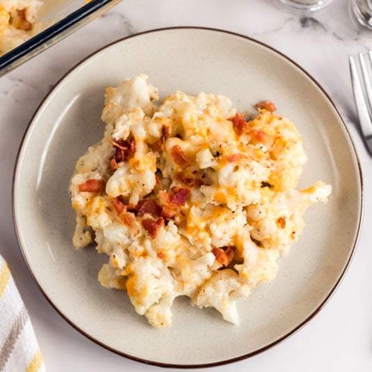 white plate with serving of loaded cauliflower casserole
