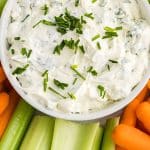 garlic herb dip topped with chives.