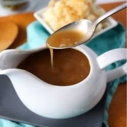 brown gravy dripping off a spoon