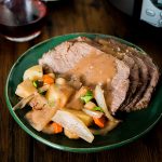 plate of pot roast topped with gravy