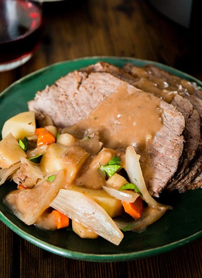 plate of pot roast topped with gravy