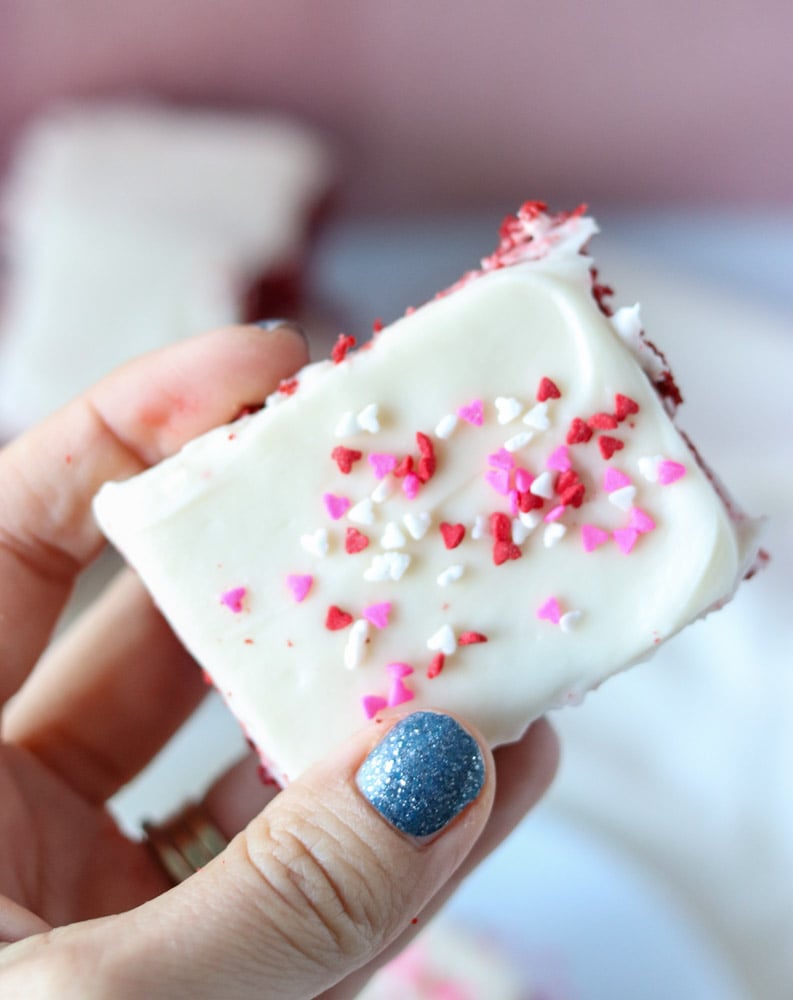hand holding a cookie bar with valentine sprinkles