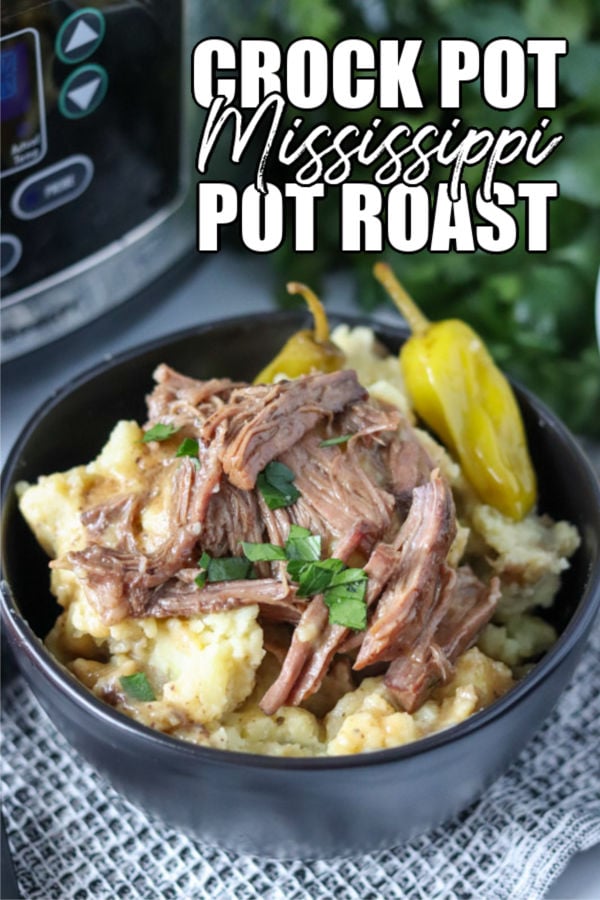 black bowl filled with mashed potatoes & pot roast
