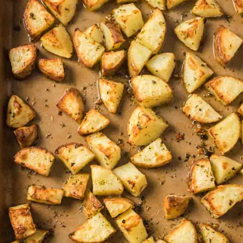overhead shot of roasted potatoes on baking sheet