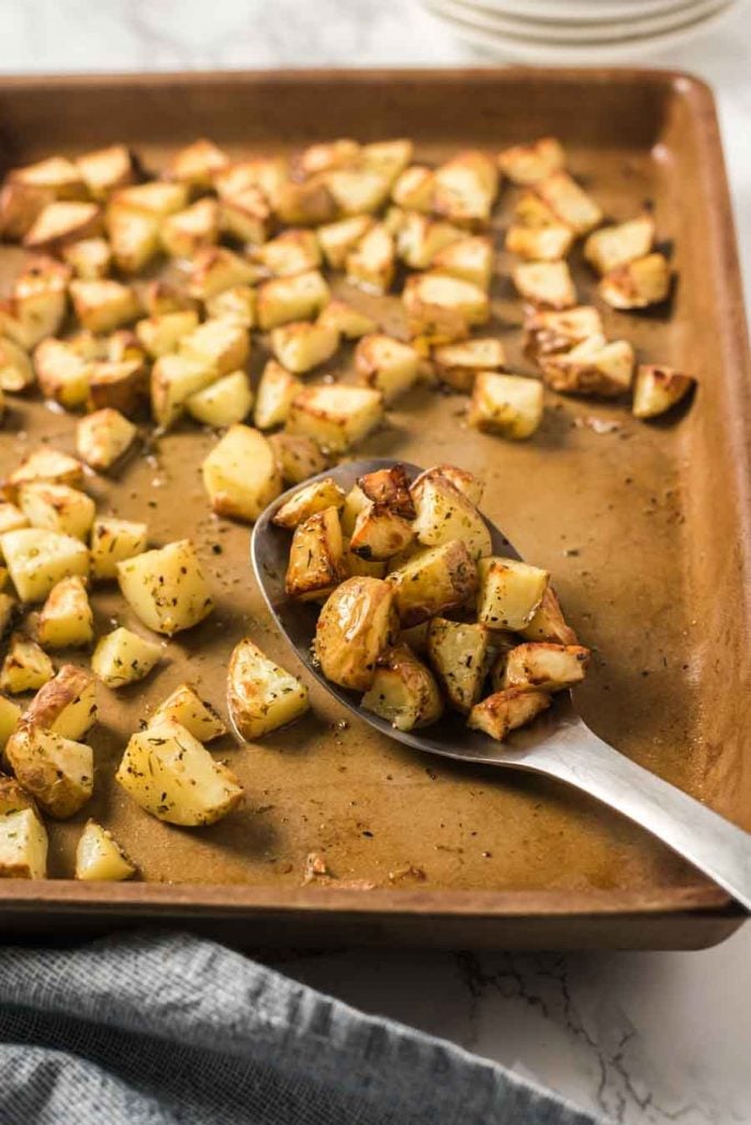 roasted potatoes on serving spoon