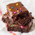 stack of chocolate brownies with rainbow sprinkles