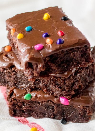 stack of chocolate brownies with rainbow sprinkles